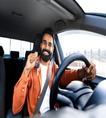 car-owner-indian-man-showing-new-auto-key-driving-vehicle (1)